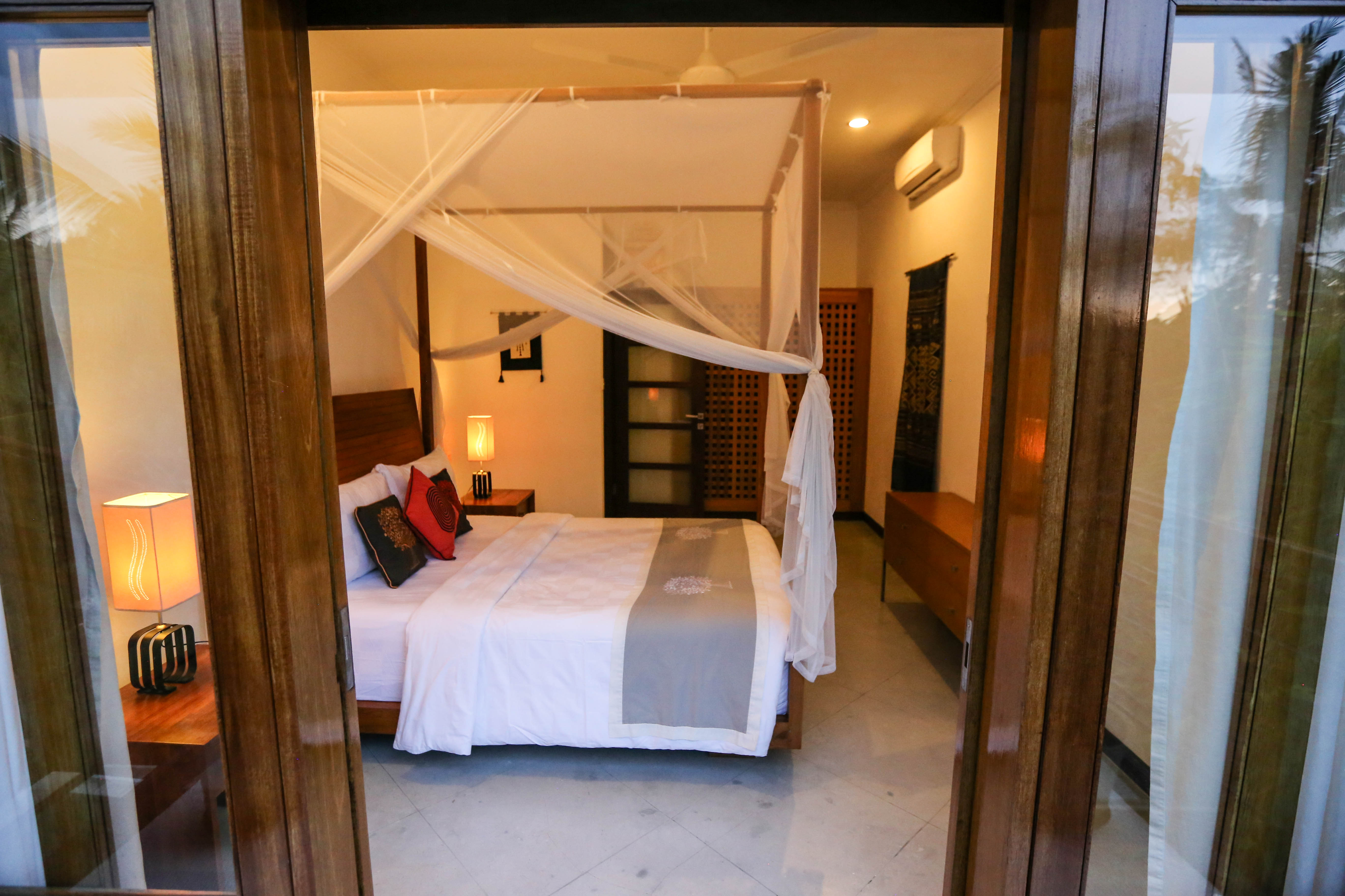 Canopy bedroom with tropical views