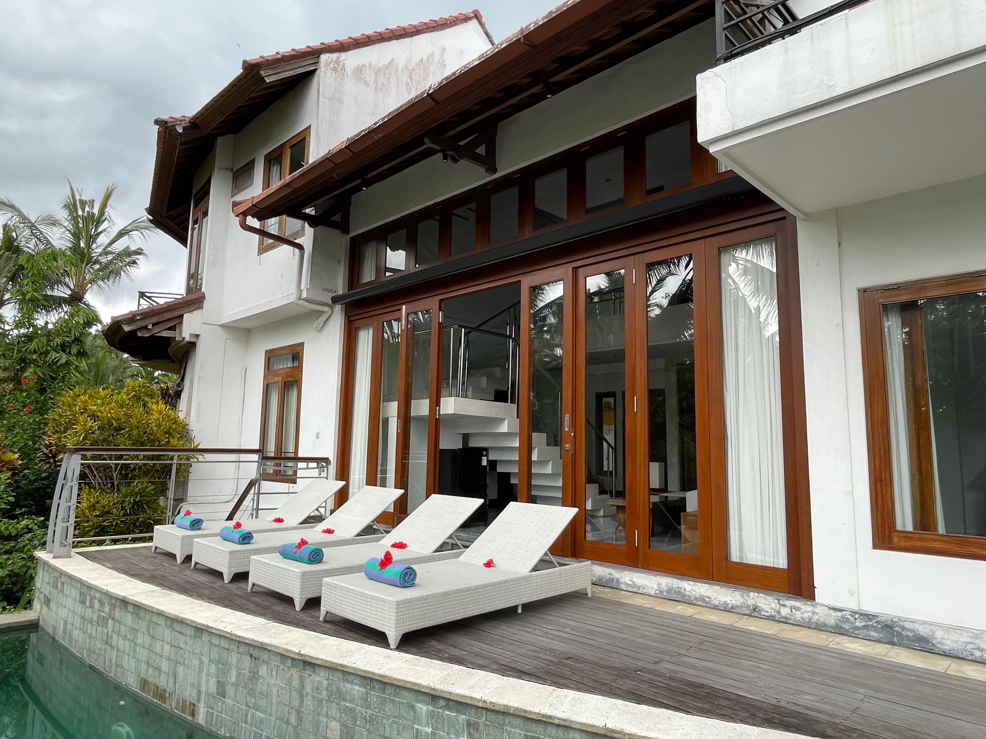 Bi-fold glass doors connecting indoor living to deck