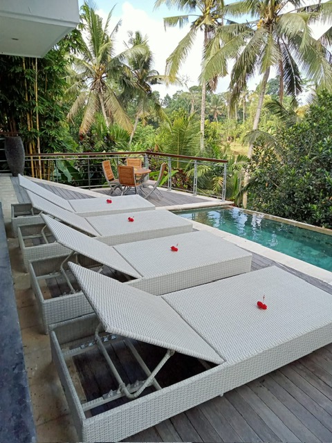 Comfortable loungers on the teak pool deck